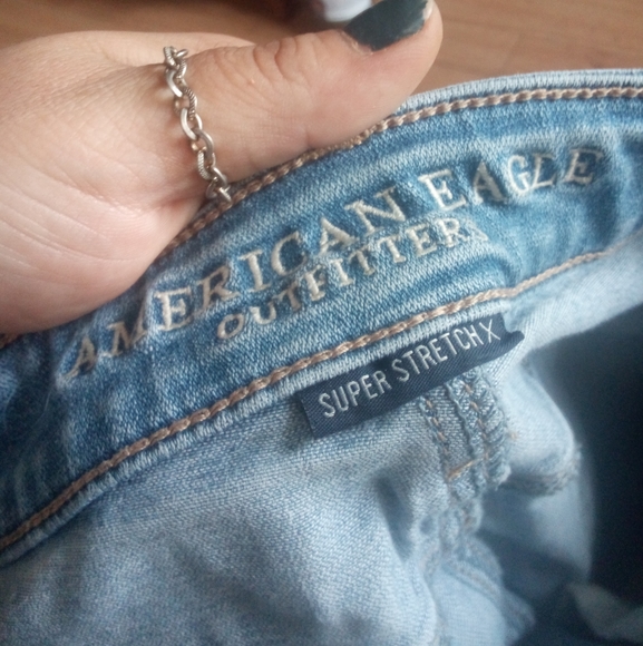 Ripped jeans made American eagle super stretch x !